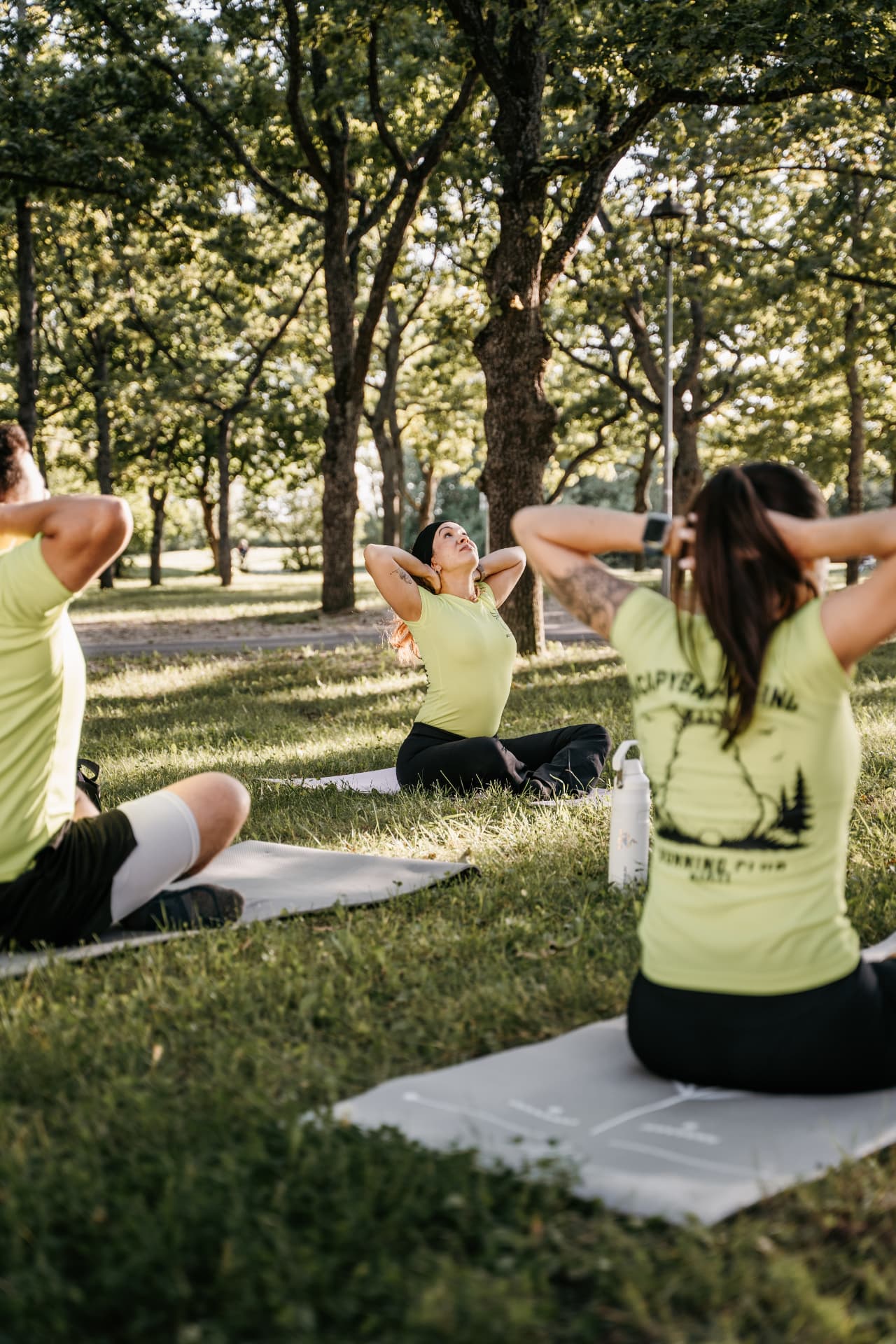 Outdoor group mobility session on mats in a Tallinn park